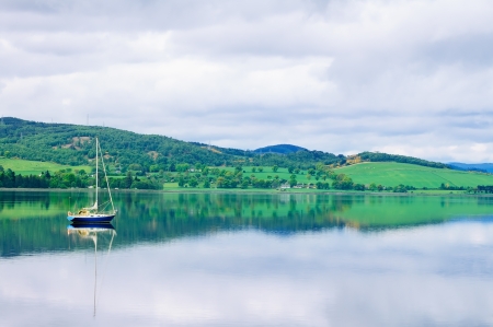 Sailing Boat in Moray Firth near Loch and River ness  Landscape in Inverness Highlands of Scotland, Uk, Europe の写真素材