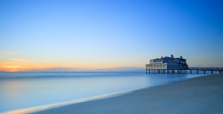 Pier and building on sea water and beach  Panoramic long exposure photography in Follonica travel destination, Maremma, Tuscany, Italy, Europeのeditorial素材