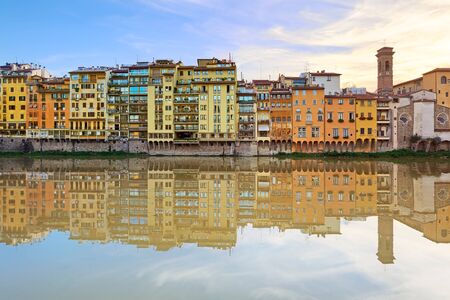 Arno river and historical buildings architecture landmark in Florence on sunset  Tuscany, Italy, Europe の写真素材