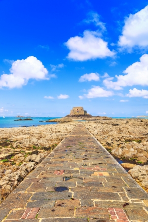 Saint Malo, Petit Be Fort and stone pathway during Low Tide  Brittany, France, Europe の写真素材