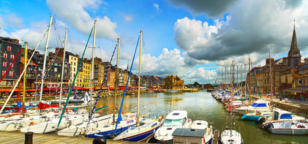 Honfleur famous village harbor skyline, boats and water. Normandy, France, Europe.の写真素材