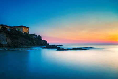 Castiglioncello travel destination, old building on the rocks and sea on sunset. Tuscany, Italy, Europe. Long Exposureの写真素材