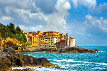 Tellaro rocks and old village on the sea. Church and houses. Five lands Cinque Terre Liguria Italy Europe.の写真素材