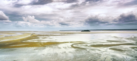 Low tide in Mont Saint Michel Bay landmark. Normandy, France, Europe