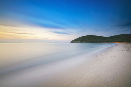Sunset Cala Violina bay beach in Maremma, Tuscany. Travel destination in Mediterranean sea. Italy, Europe. Long Exposure.の写真素材
