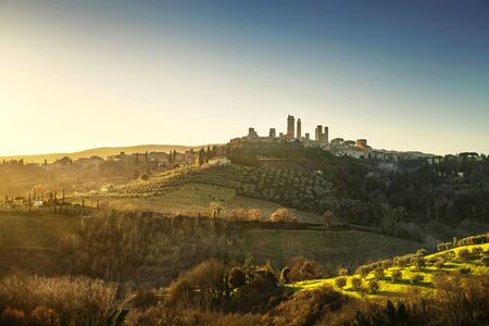 San Gimignano medieval town towers skyline and countryside landscape panorama on sunset. Tuscany, Italy, Europe.の写真素材
