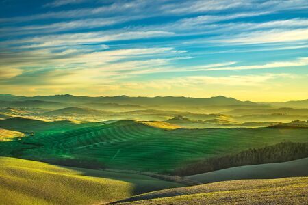 Volterra winter panorama, rolling hills and green fields on sunset. Tuscany Italy, Europeの写真素材