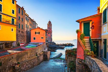 Tellaro sea village street, church and boats. Five lands, Cinque Terre, Liguria Italy Europe.の写真素材