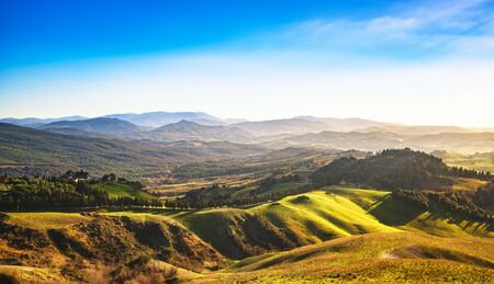 Volterra winter panorama, rolling hills and green fields on sunset. Tuscany Italy, Europeの写真素材