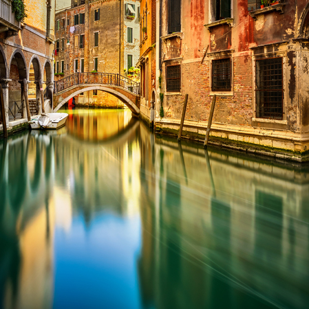 Venice sunset cityscape, bridge, water canal and traditional buildings. Italy, Europe. Long exposureの写真素材