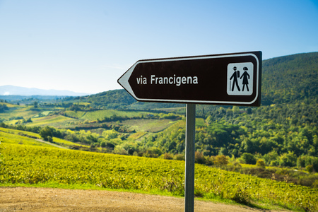 SAN GIMIGNANO, TUSCANY / ITALY - OCTOBER 7, 2017: Road sign of the historic route Via Francigena on October 7, 2017 in San Gimignano countryside. Via Francigena is a famous pilgrim path and hiking trail running from France to Rome.のeditorial素材