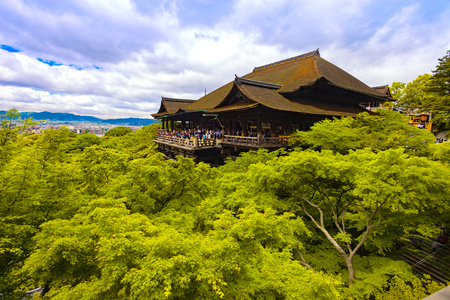 KYOTO / JAPAN - MAY 27, 2010 : Tourists visiting Kiyomizu dera Hondo buddhist temple on May 27, 2010 in Kyoto, Japan. The temple is part of the monuments of ancient Kyoto UNESCO world heritage site.のeditorial素材