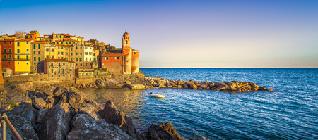 Tellaro rocks and old village on the sea. Church and houses. Five lands, Cinque Terre, Liguria Italy...