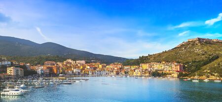 Porto Ercole village and boats in harbor in a sea bay. Aerial view. Monte Argentario, Maremma Grosseto Tuscany, Italyの写真素材