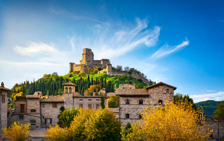 Assisi town and Rocca Maggiore view at sunset. Perugia, Umbria, Italy, Europe.の写真素材