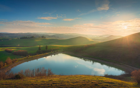 Lake and rolling hills. Via Francigena landscape. Castelfiorentino, Firenze, Tuscany, Italyの写真素材