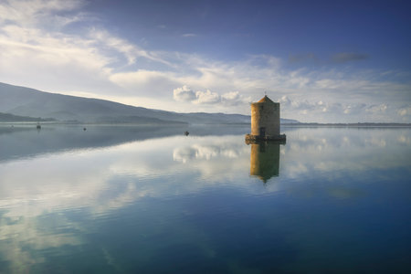 Old spanish windmill in Orbetello lagoon, medieval landmark in Monte Argentario, Tuscany, Italy.の素材 [FY310161780238]