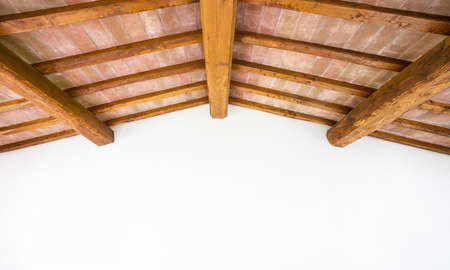 Tuscan traditional oak wood beam ceiling, red bricks pattern and white wall as copyspace. Classic...
