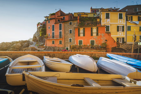 Boats in Tellaro village at sunset. Golfo dei Poeti or Gulf of Poets. Liguria region, Italy, Europe.の写真素材