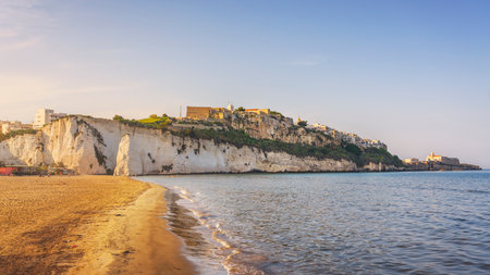 Vieste village view and Pizzomunno rock from the beach, Gargano peninsula, Apulia or Puglia region, Italy, Europe.の写真素材