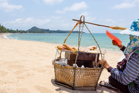 April 07, 2016, Koh Samui, Thailand, Vendors basket on sandy beachのeditorial素材