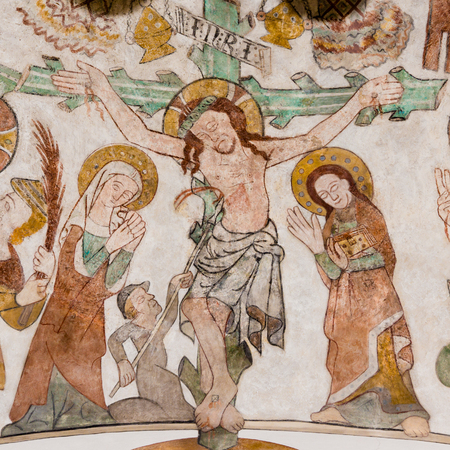 The crucifixion of Jesus on Good Friday. His mother Mary and St. John standing at the cross with the...