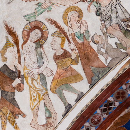 The passion of Christ. Jesus is attached to a pole and flogged. A gothic fresco in Skibby church,...
