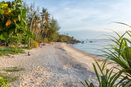 Paradise beach with som peple relaxing in the lateafternoon sunshine. Haad Son, Koh Pangan, Thailand, May 8, 2016,のeditorial素材