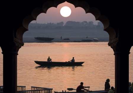 Sunrise over the Holy River Ganges in Varanasi in the Uttar Pradesh region of northern Indiaのeditorial素材