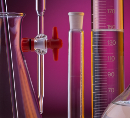 Chemical laboratory glassware - measuring cylinder, pipet, volumetric flask and conical flask の写真素材
