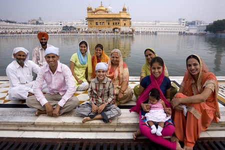 A family of Sikh pilgrims at the Golden Temple of Amritsar in the town of Amritsar in the Punjab...