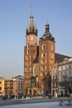 The Church of St Mary in the Main Square (Rynek Glowny) in the city of Kracow in Poland. This gothic basilica is also known as the Church of the Assumption of the Virgin.のeditorial素材