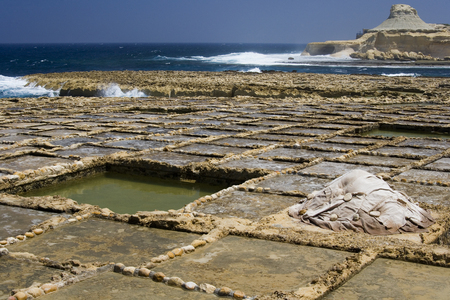 Salt pans on the cost at Qbaijar near Marsalforn on the small island of Gozo - Maltaの写真素材