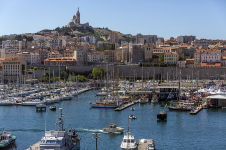 Vieux Port of Marseille  Looking towards the Cathedral de Notre-Dame-de-la-Garde high on a hill overlooking the city  South of Franceのeditorial素材