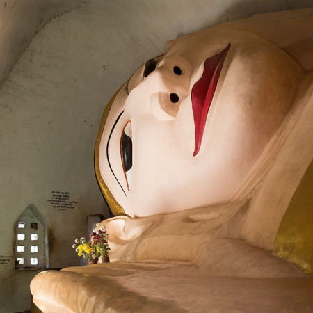 A huge reclining Buddha image inside a very small temple near the Htilominlo Temple in the Archaeological Zone of Bagan in Myanmar  Burma  の写真素材
