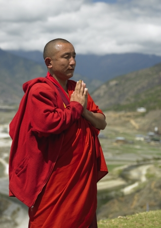 A Buddhist monk near Paro Dzong in the Kingdom of Bhutan.のeditorial素材