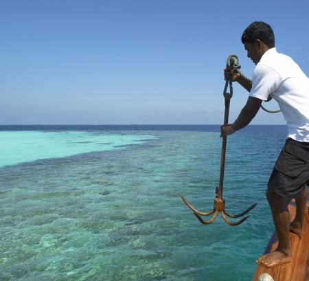 Dropping anchor in a tropical lagoon in the Maldives in the Indian Ocean.のeditorial素材