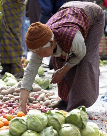 A Bhutanese woman at Paro Food Market in the town of Paro in the Kingdom of Bhutan.のeditorial素材