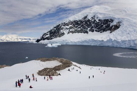 An group of adventure tourists on Nikko Island in Antarcticaの写真素材