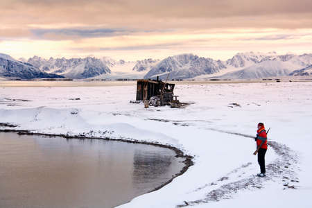 Late afternoon sun colors the mountains of Raudfjord on the Svalbard Islands (Spitsbergen) in the High Arctic.のeditorial素材