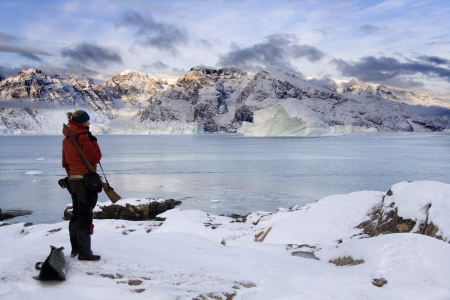 Armed adventurer (due to Polar Bear threat) in Scoresbysund in eastern Greenlandのeditorial素材