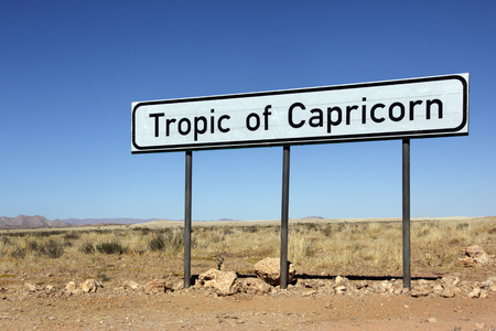 Tropic of Capricorn sign on a remote desert road in Namibiaの写真素材