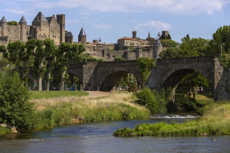 The medieval fortress and walled city of Carcassonne in south west France  Founded by the Visigoths in the fith century, it was restored in 1853 and is now a UNESCO World Heritage Site  Viewed over the Pont Vieux crossing the Aude River のeditorial素材