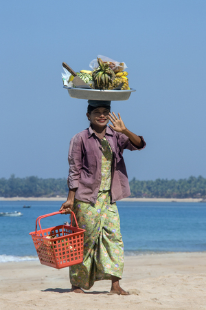 A Burmese Fruit Seller on Ngapali Beach in Rakhine State in Myanmar - Burma  のeditorial素材