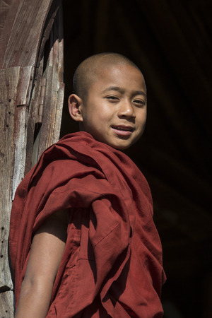 Young novice monk at Shwe Yaunghwe Kyaung Monastery at Nyaungshwe near Inle Lake in Shan State in central Myanmar - Burma  のeditorial素材