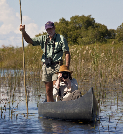 Tourist and guide in the Okavango Delta in Botswana のeditorial素材