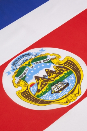 The official flag of the Republic of Costa Rica is based on a design created in 1848  The state or national flag, also used as the military ensign, includes the coat of arms of Costa Rica の写真素材