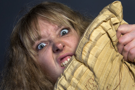 A crazy psychotic young womanの写真素材