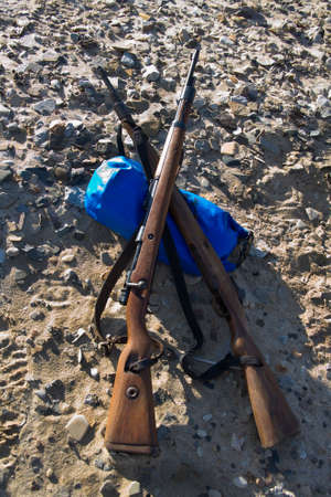 Pair of old rifles - Rifles are fired from shoulder level and have a long spirally grooved barrel that  makes the bullet spin resulting in greater accuracy over a long distanceの写真素材