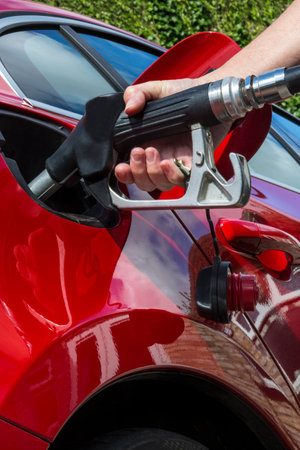 Pumping Gas - Filling a car fuel tank with diesel or petroleum の写真素材